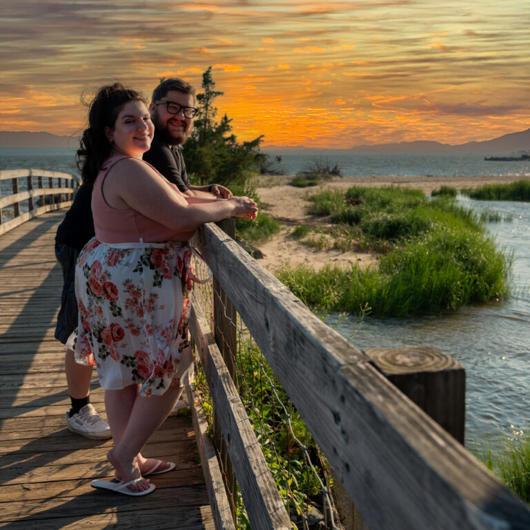 Kaylan and Joe Engagement picture hand in hand at sunset, taken at Sandy Hook, NJ