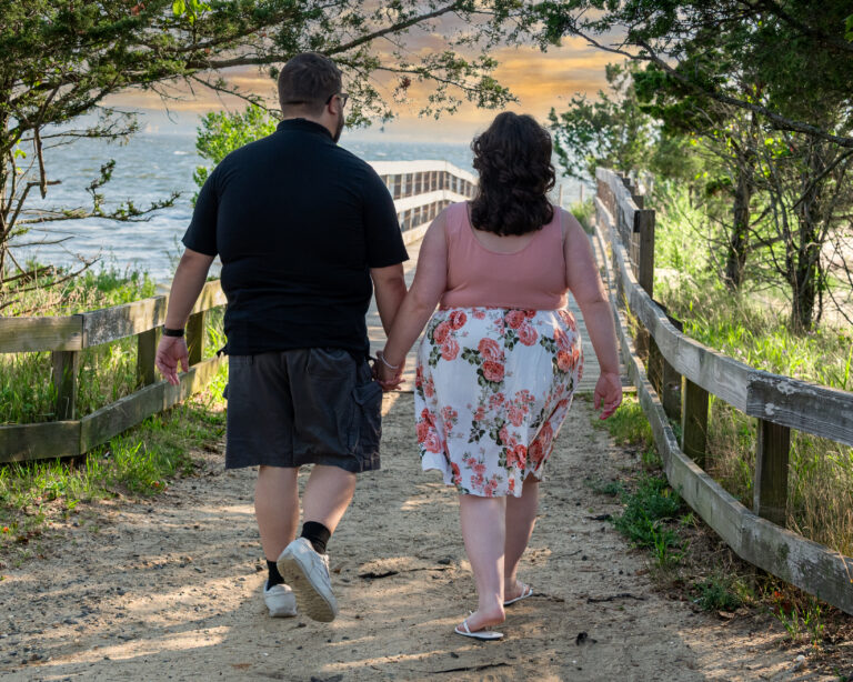 Kaylan and Joe Engagement picture walking into forever, 2taken at Sandy Hook, NJ