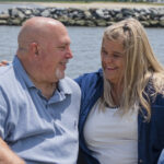 Couple enjoying the breeze at Bowers Beach, Kent County, Delaware during family portraits